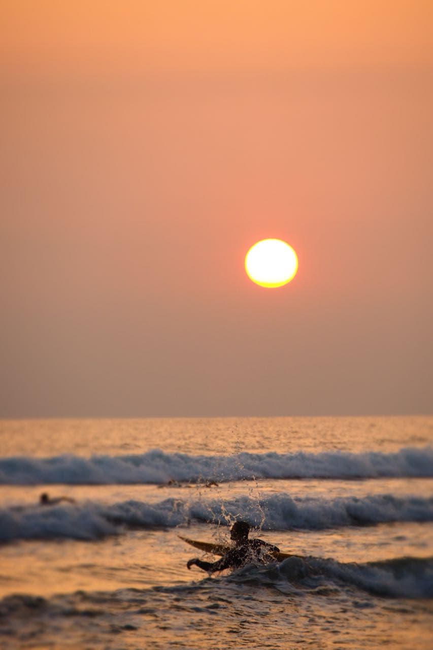 Surfer at sunset